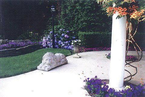 Backyard Lawn with Lavender Color Flowers — Lakewood, NJ — Howard Payne Landscaping & Design Inc.