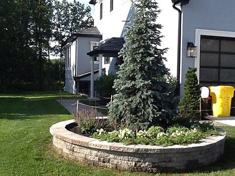 Circle Flower Bed Stonework — Lakewood, NJ — Howard Payne Landscaping & Design Inc.
