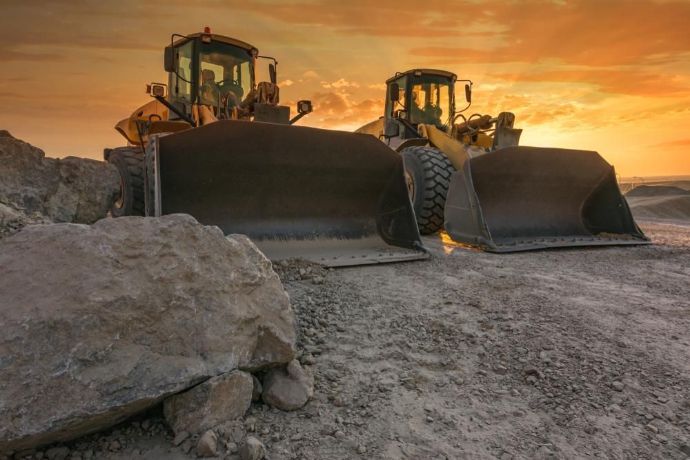 Two Bulldozers Are Working on a Construction Site at Sunset — Zappala Quarries in Gordonvale, QLD