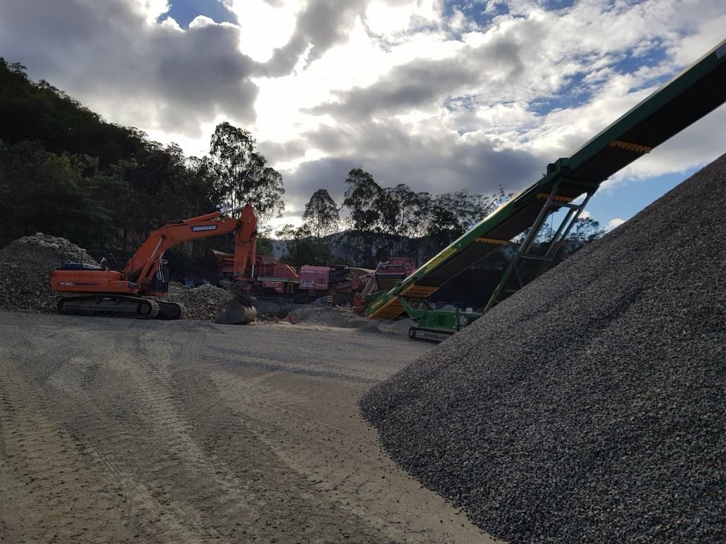 A Large Pile of Gravel Is Sitting in The Middle of A Construction Site — Zappala Quarries in Gordonvale, QLD