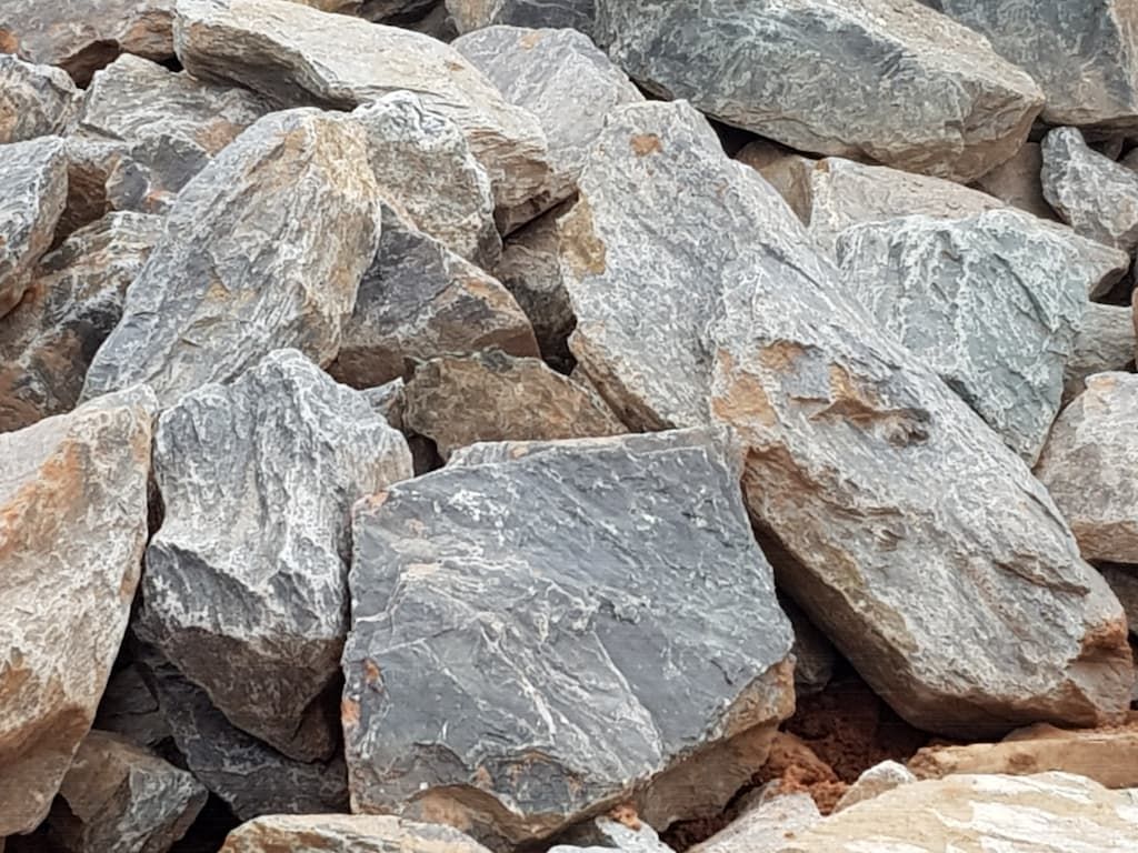 A pile of rocks sitting on top of each other on the ground — Zappala Quarries in Gordonvale, QLD
