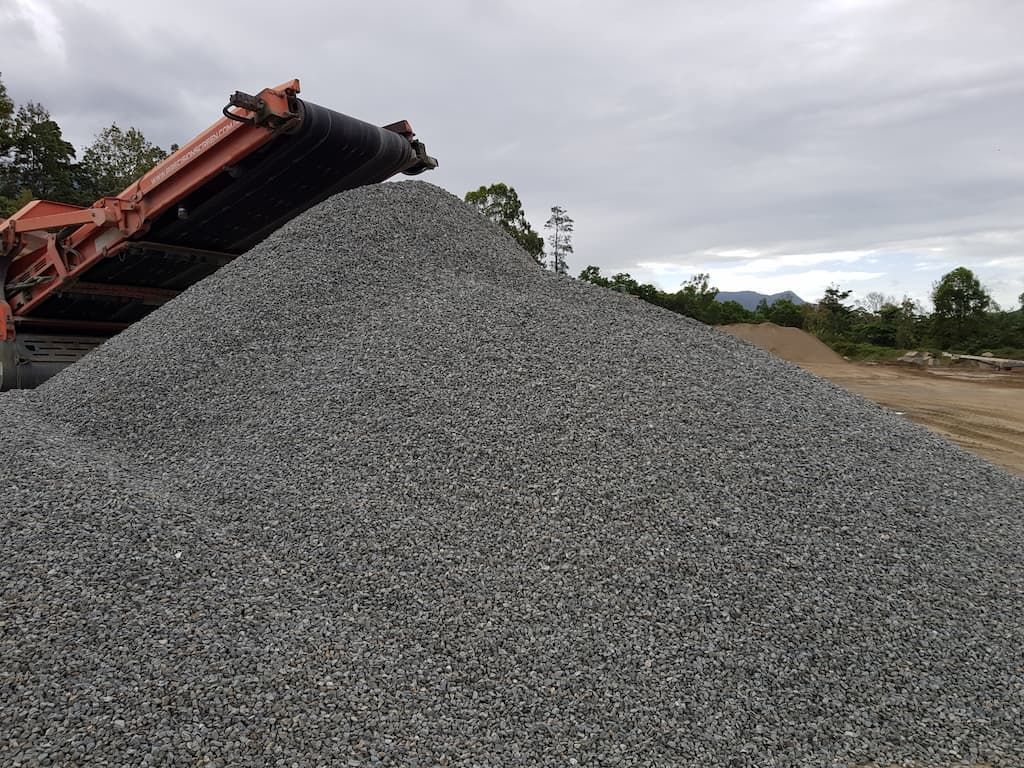 A Large Pile of Gravel Is Sitting on Top of A Dirt Field — Zappala Quarries in Gordonvale, QLD