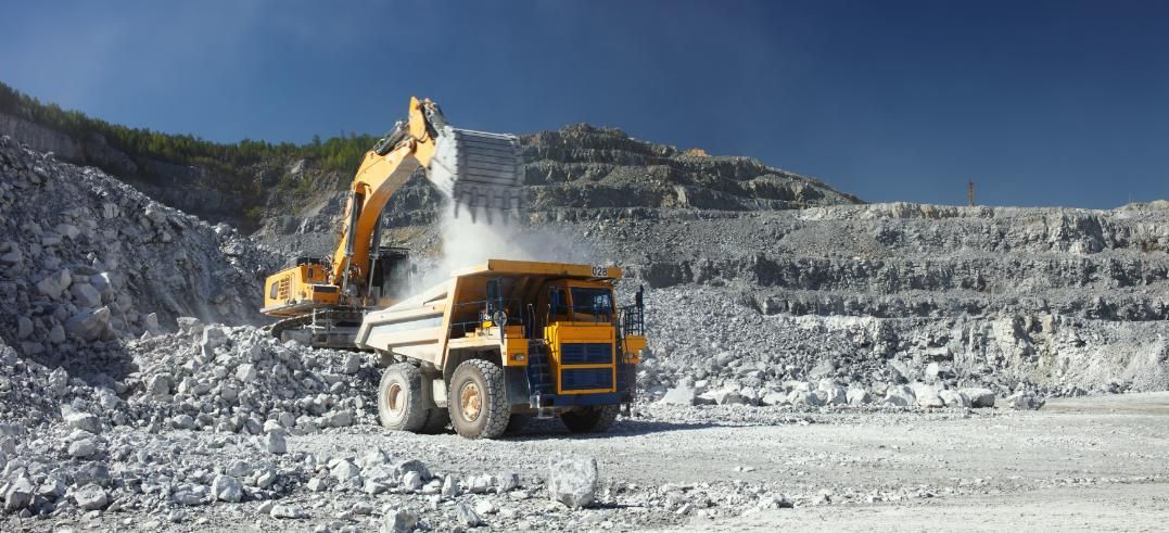 A Dump Truck is Being Loaded With Rocks in a Quarry — Zappala Quarries in Gordonvale, QLD