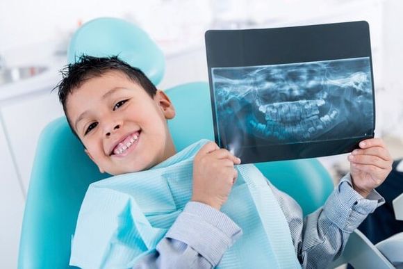 Boy Holding Xray Result of Gum - Dentist in Lake Charles, LA