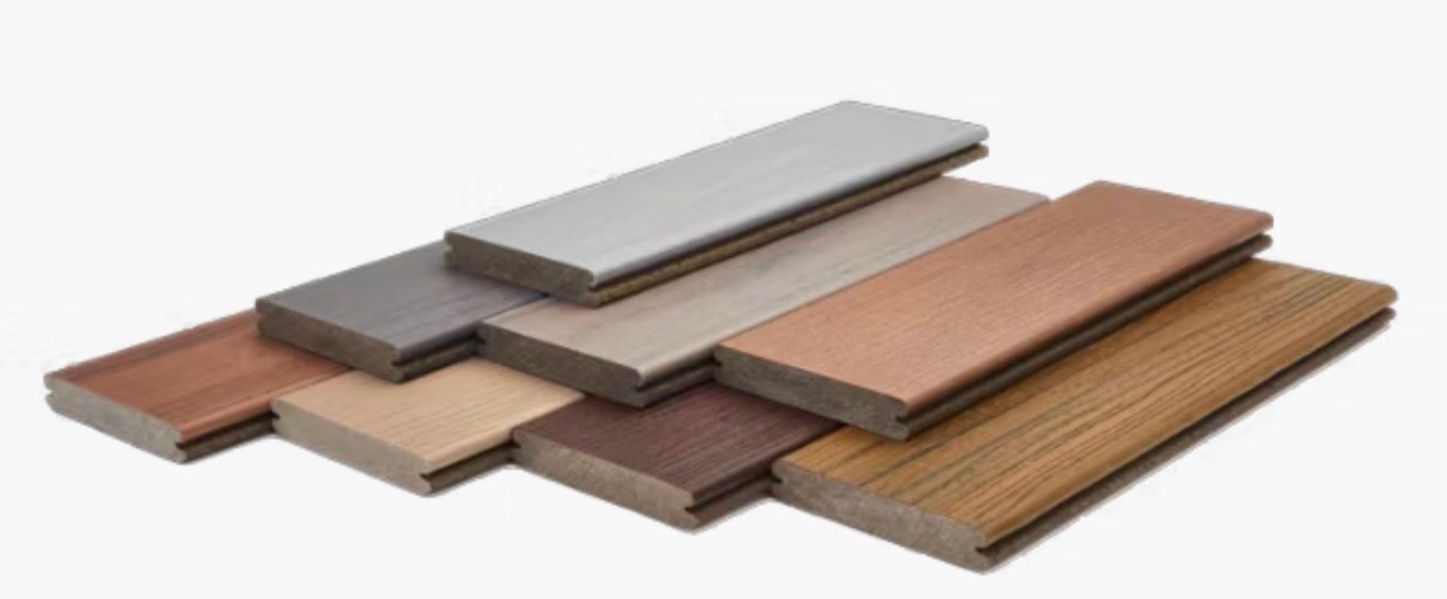 Pile of various colored composite decking boards.