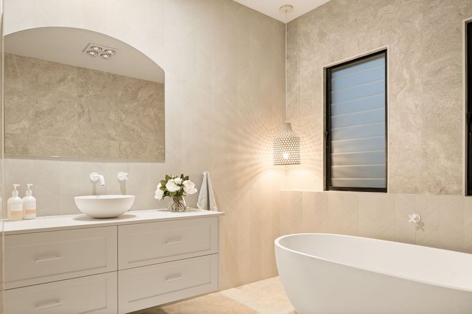 Bathroom With White Cabinets and Bath — Halls Cabinets & Joinery in Harlaxton, QLD