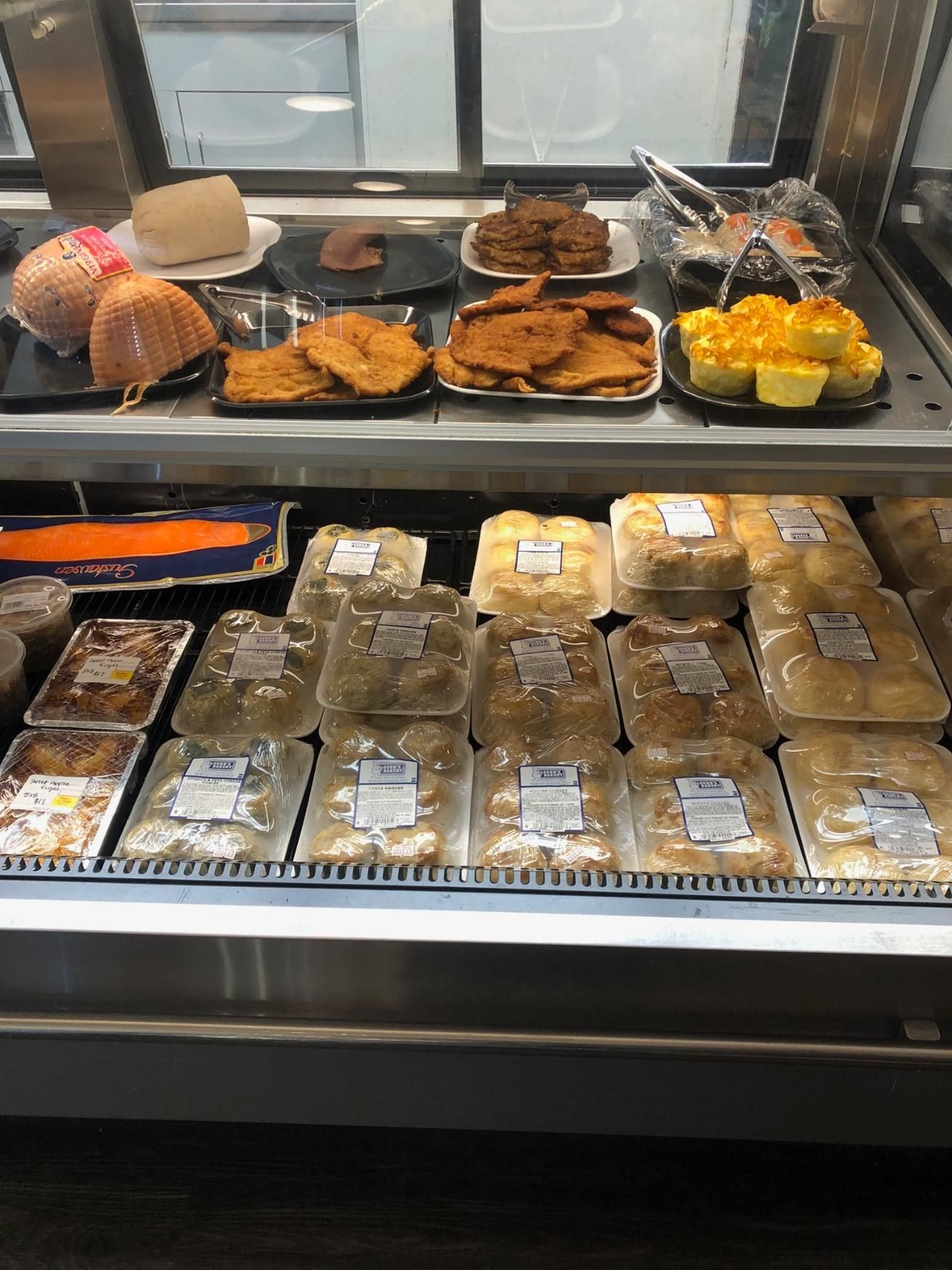 An empty restaurant with tables and chairs set for dinner
