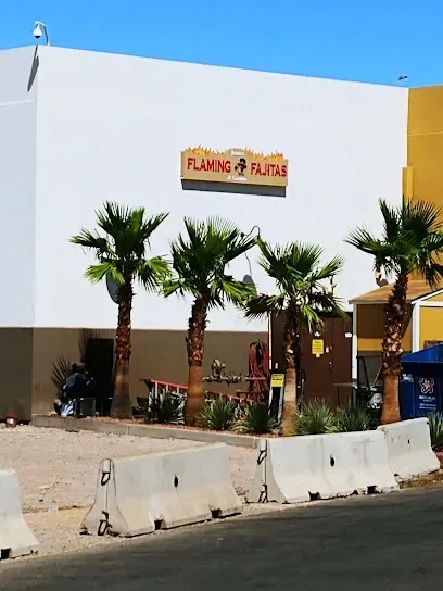 A building with a sign that says flaming fajitas on it