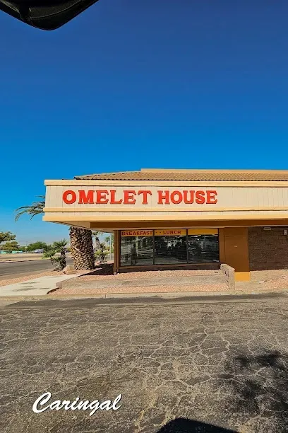 A building with a sign that says omelet house on it