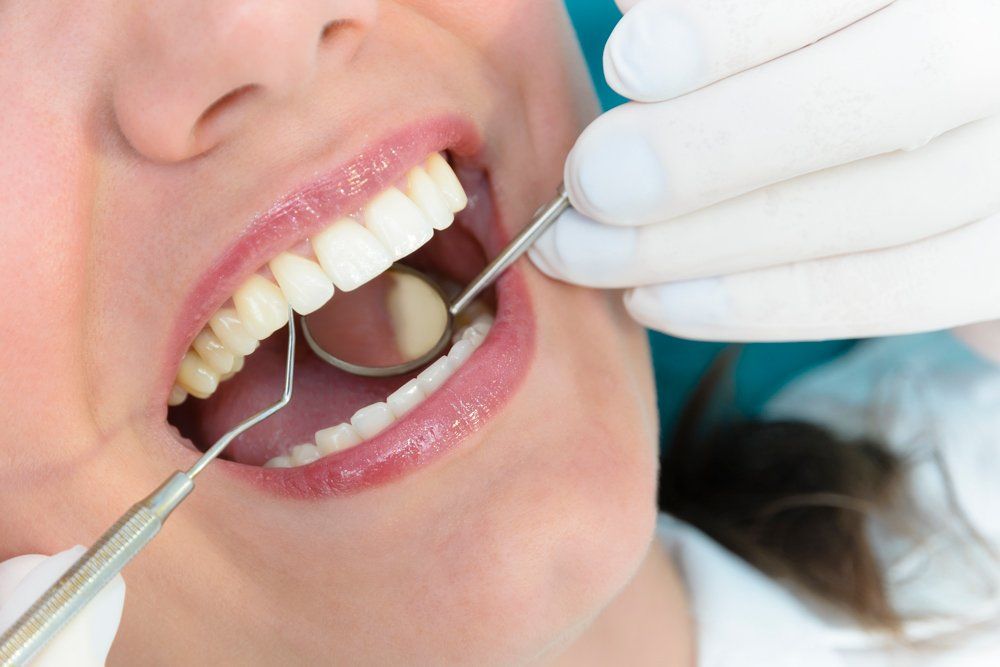 Woman at Dental Consultation — Lutz, FL — Dr. William J Geyer Dr. Leslie Hernandez