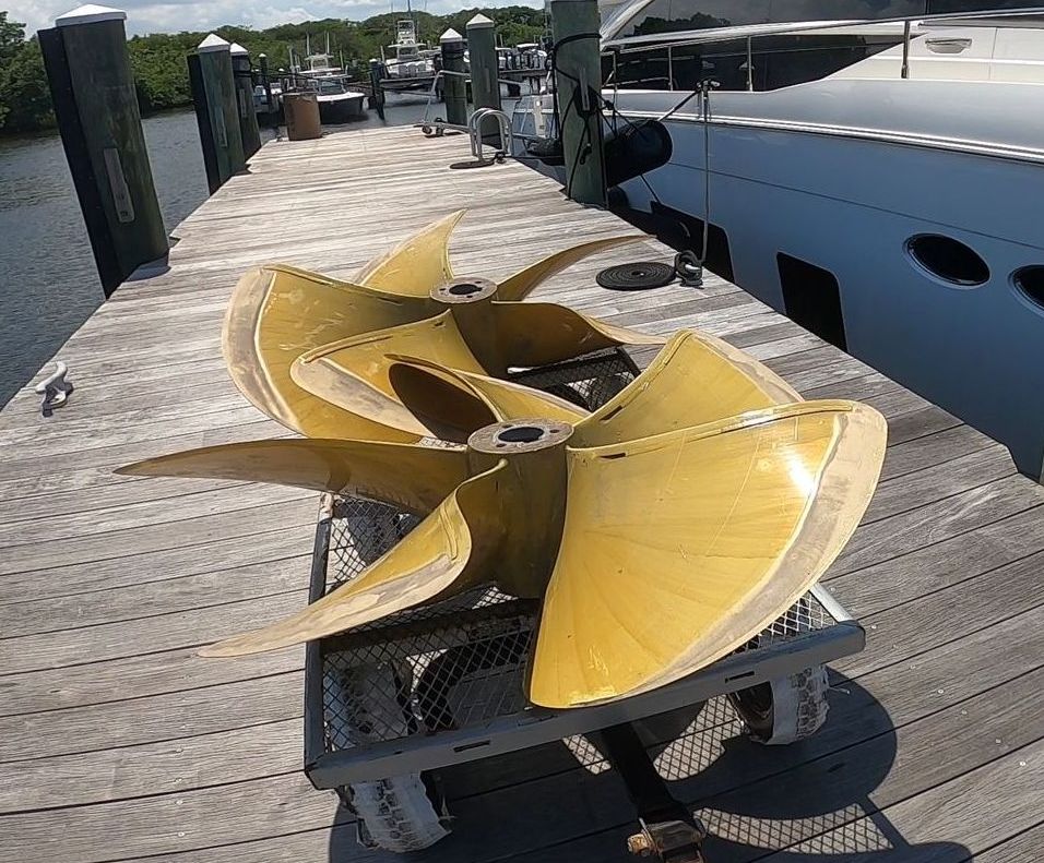 large yacht propeller being installed