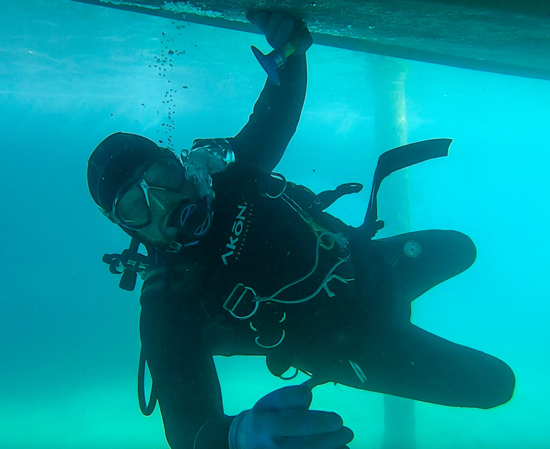 Diver cleaning the hull of a boat in Palm Beach County