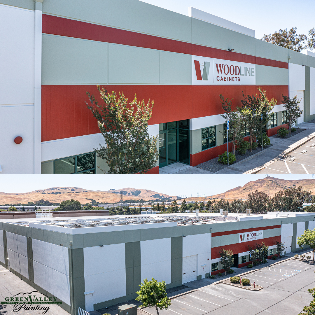 A large building with a lot of windows and trees in front of it.