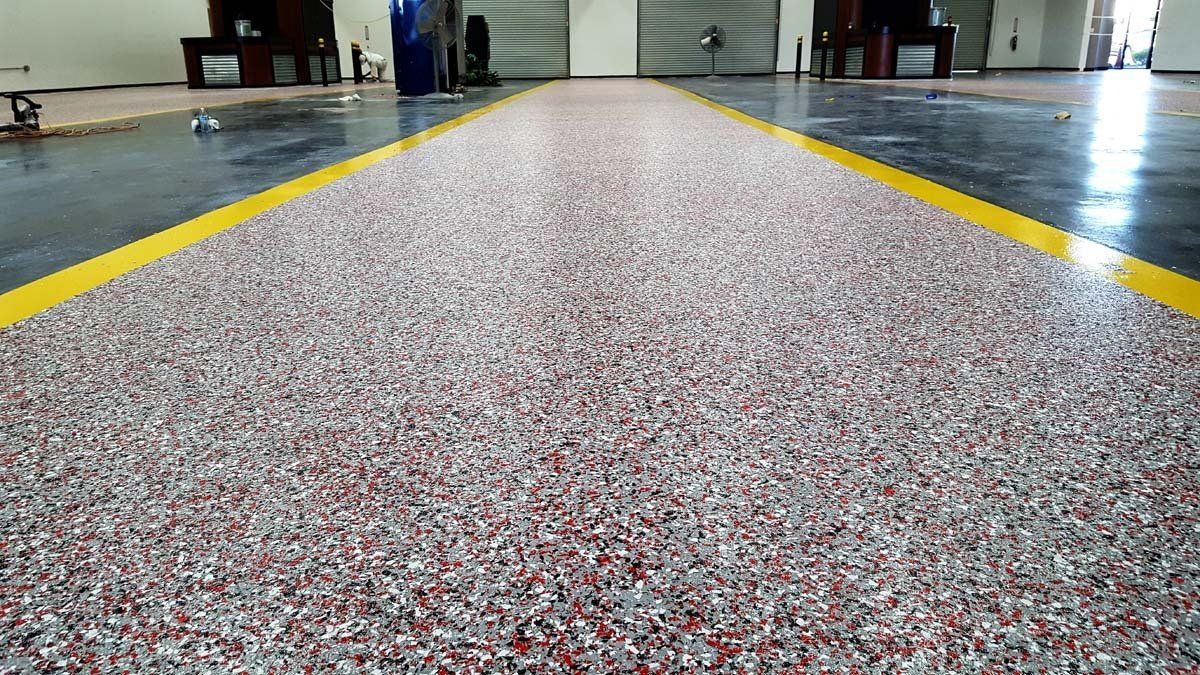 There is a yellow line on the floor of a building.