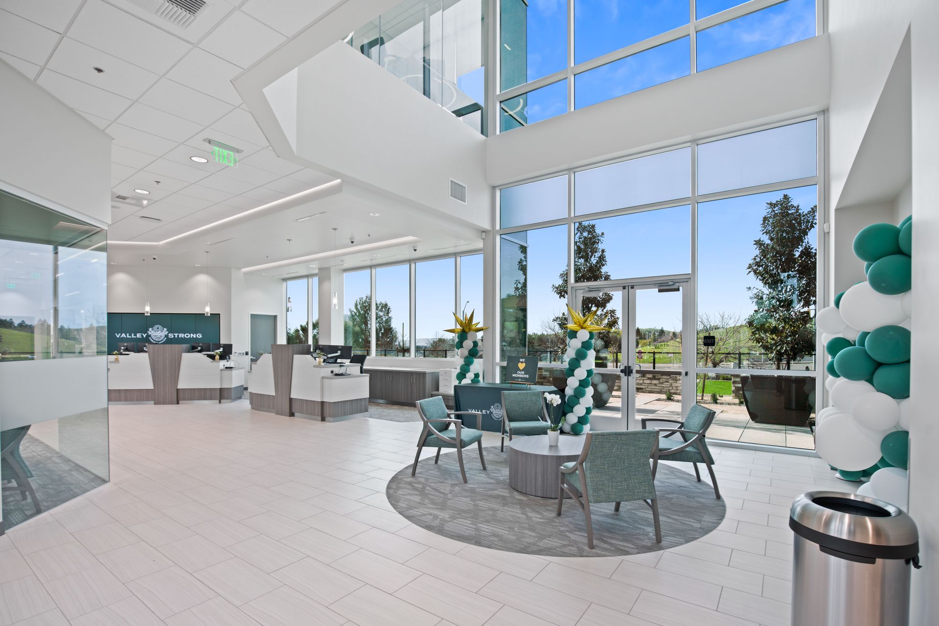 A large room with a lot of windows and furniture