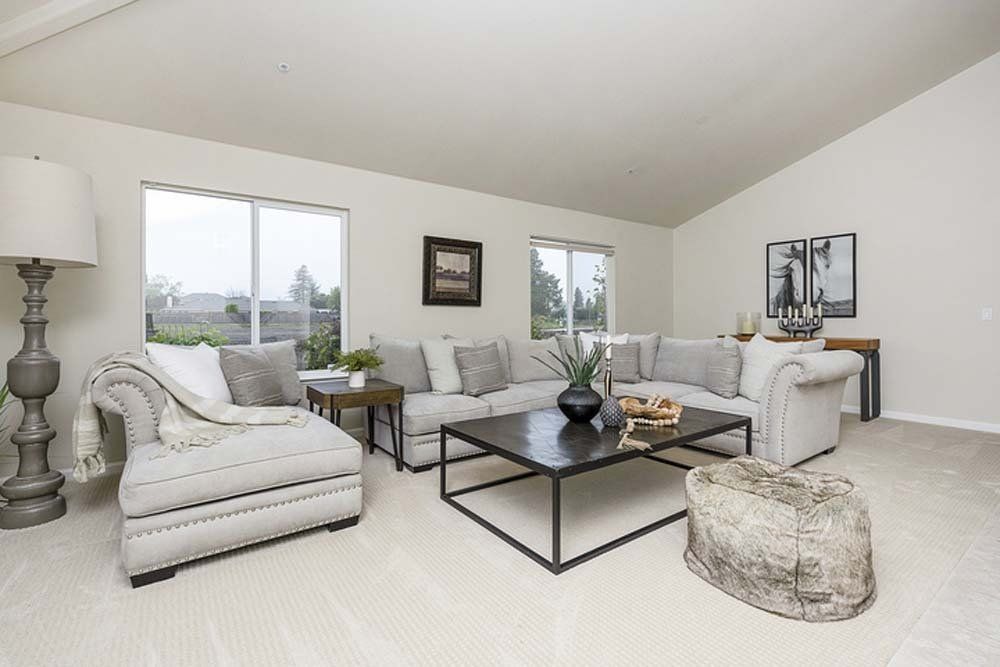 A living room filled with furniture and a coffee table.