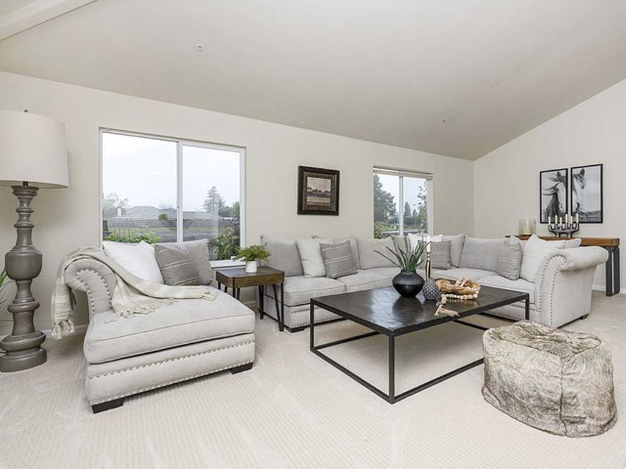 A living room filled with furniture and a coffee table.