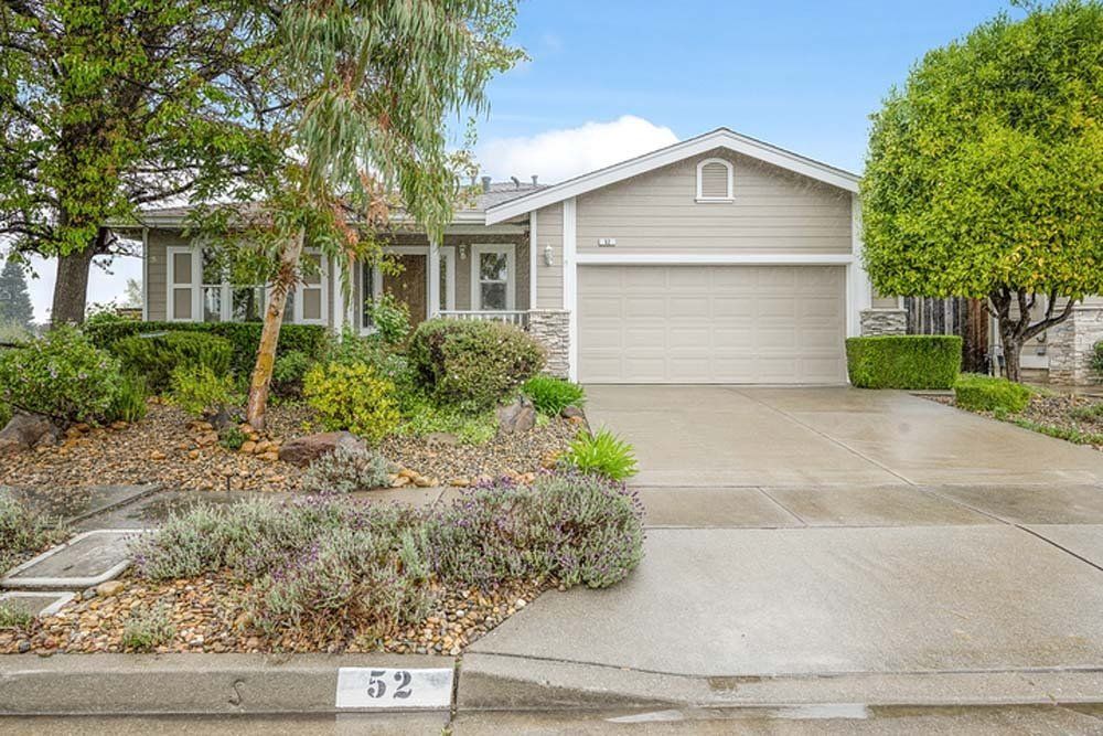 The front of a house with a garage and a driveway
