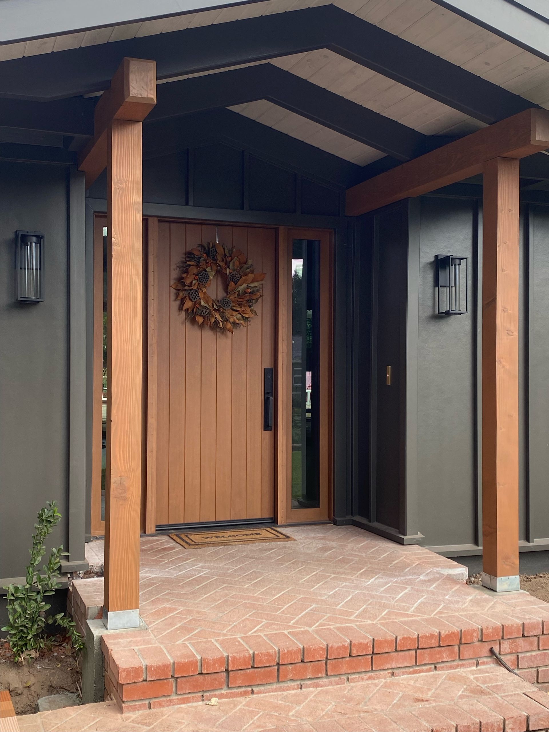 The front door of a house with a wreath on it
