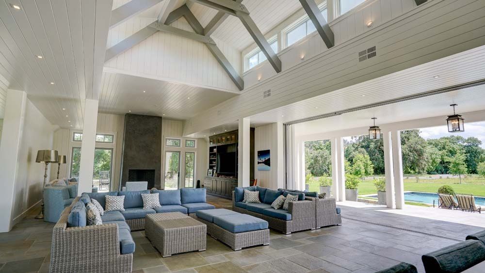 A living room with a lot of furniture and a fireplace