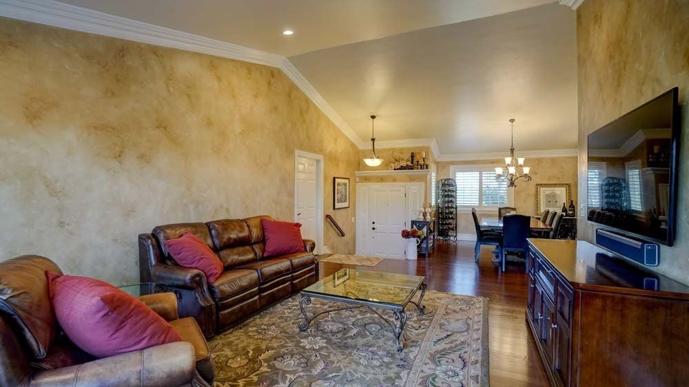 A living room filled with furniture and a flat screen tv.