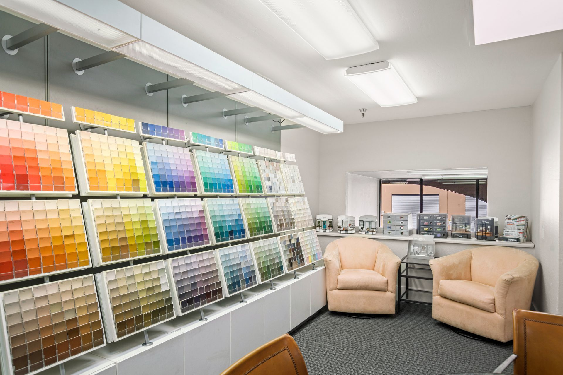 A room with a lot of paint samples on display