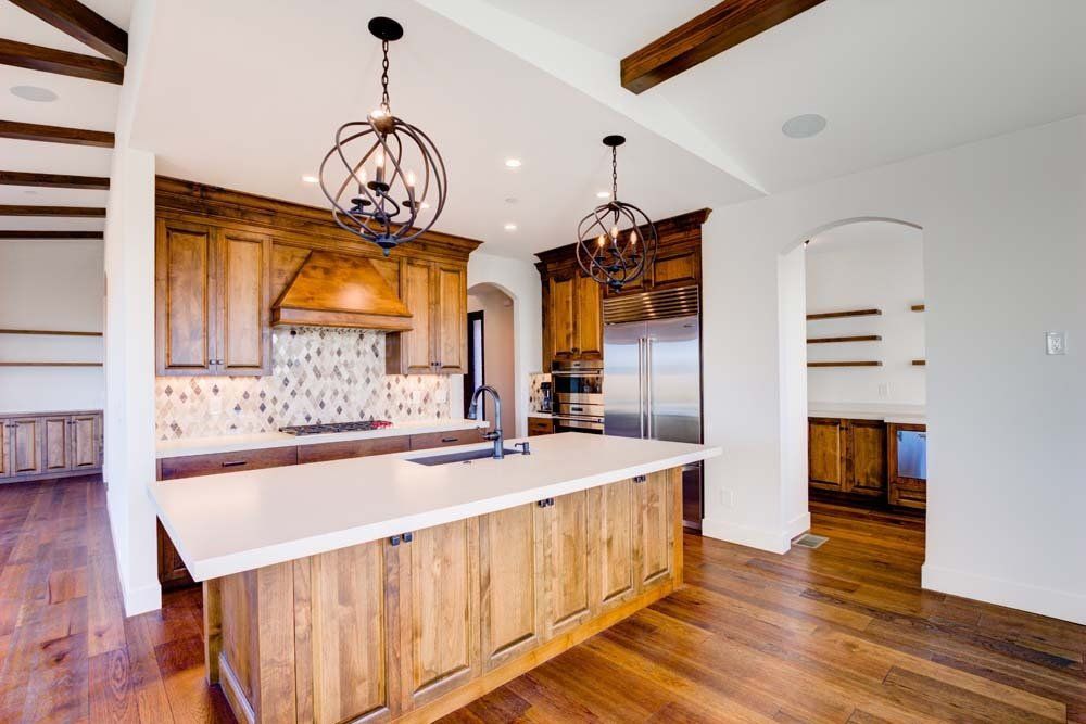 There is a large island in the middle of the kitchen.