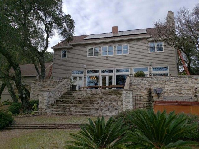 A large house with a lot of windows and stairs