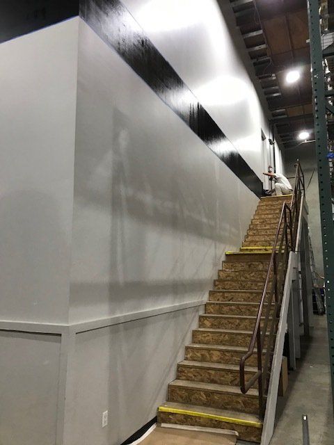 A set of stairs leading up to the second floor of a building.