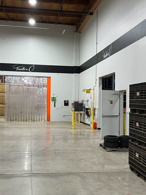 A warehouse with a sign that says ' feather ' on it