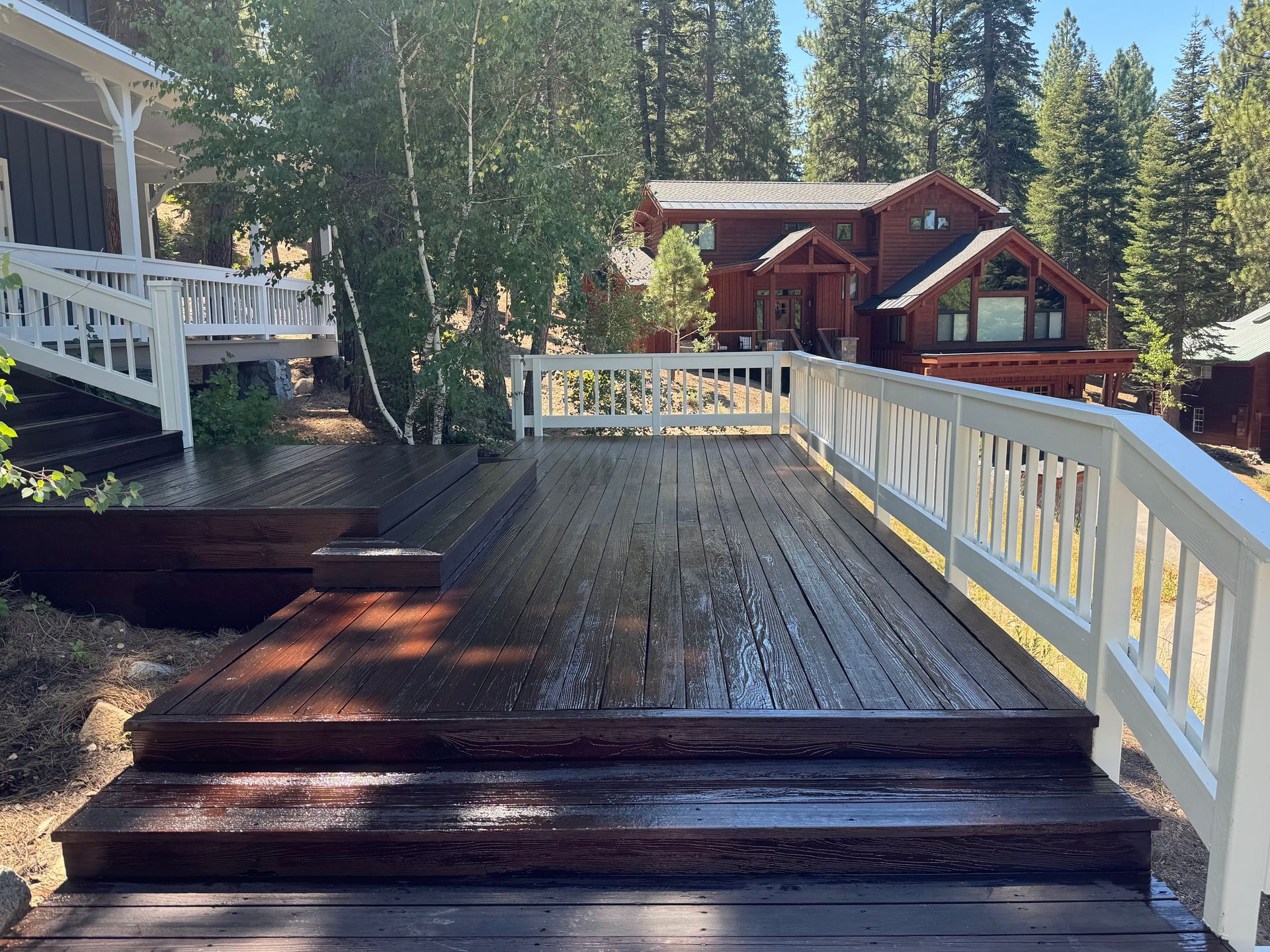 A large wooden garage door is sitting in front of a house