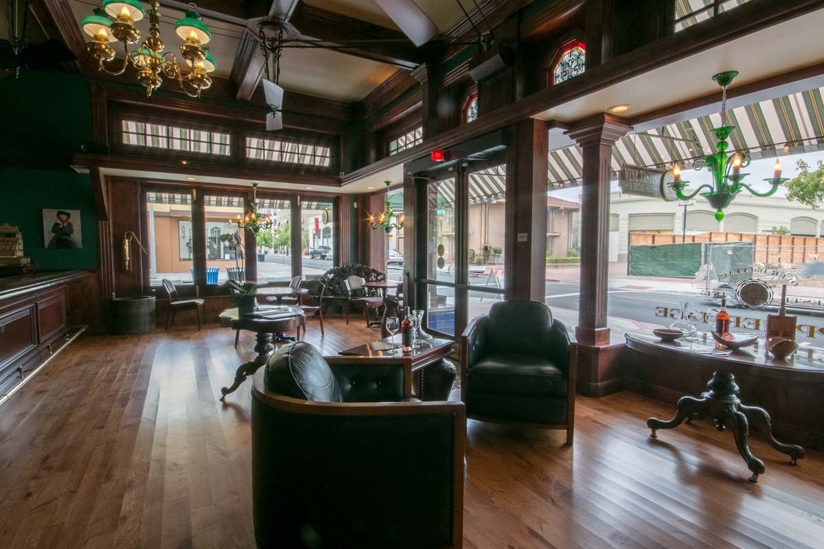 A large room with a lot of windows and furniture.