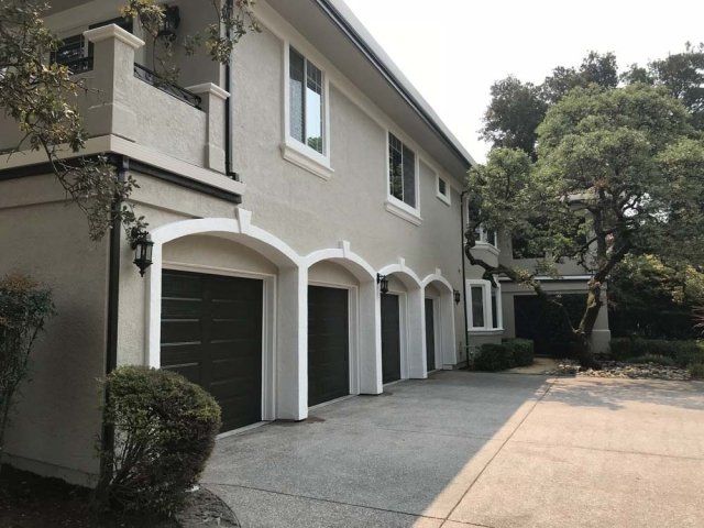 A large house with a lot of garage doors