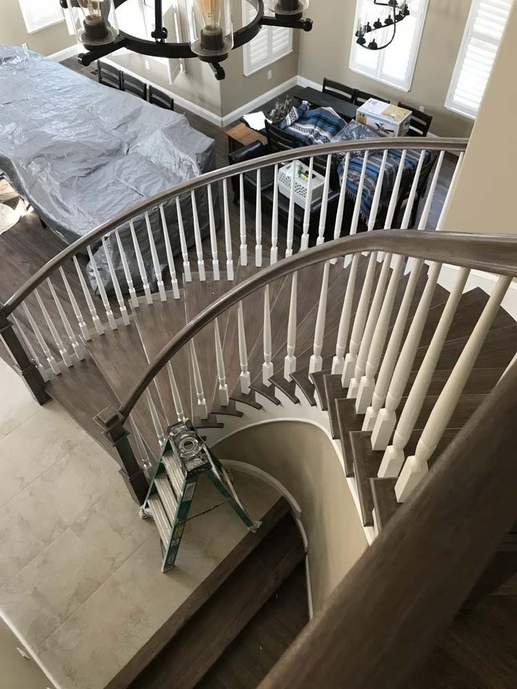 An aerial view of a spiral staircase in a house.
