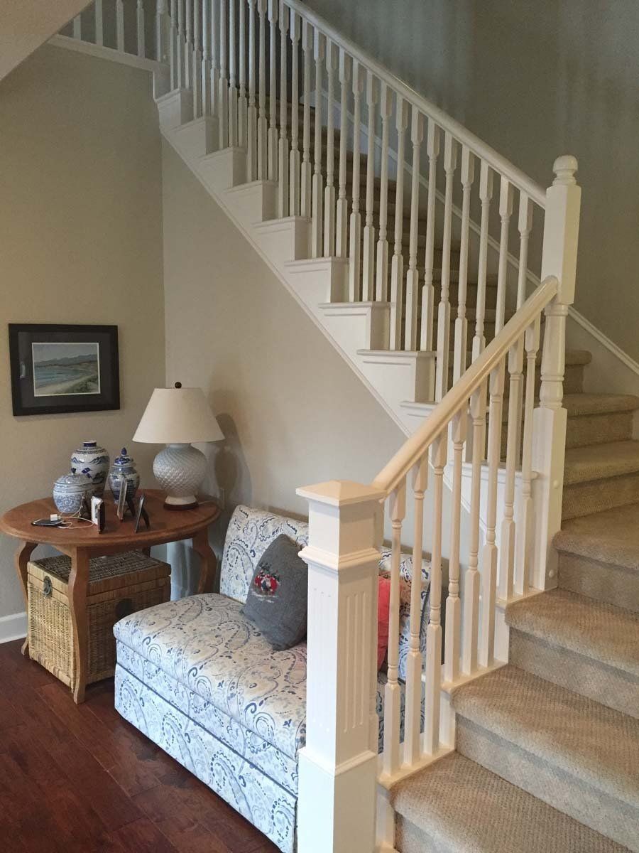 A living room with stairs and a couch