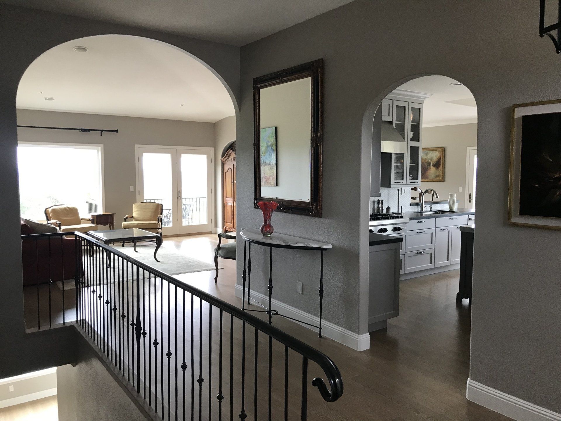 A staircase leading to a living room and kitchen in a house