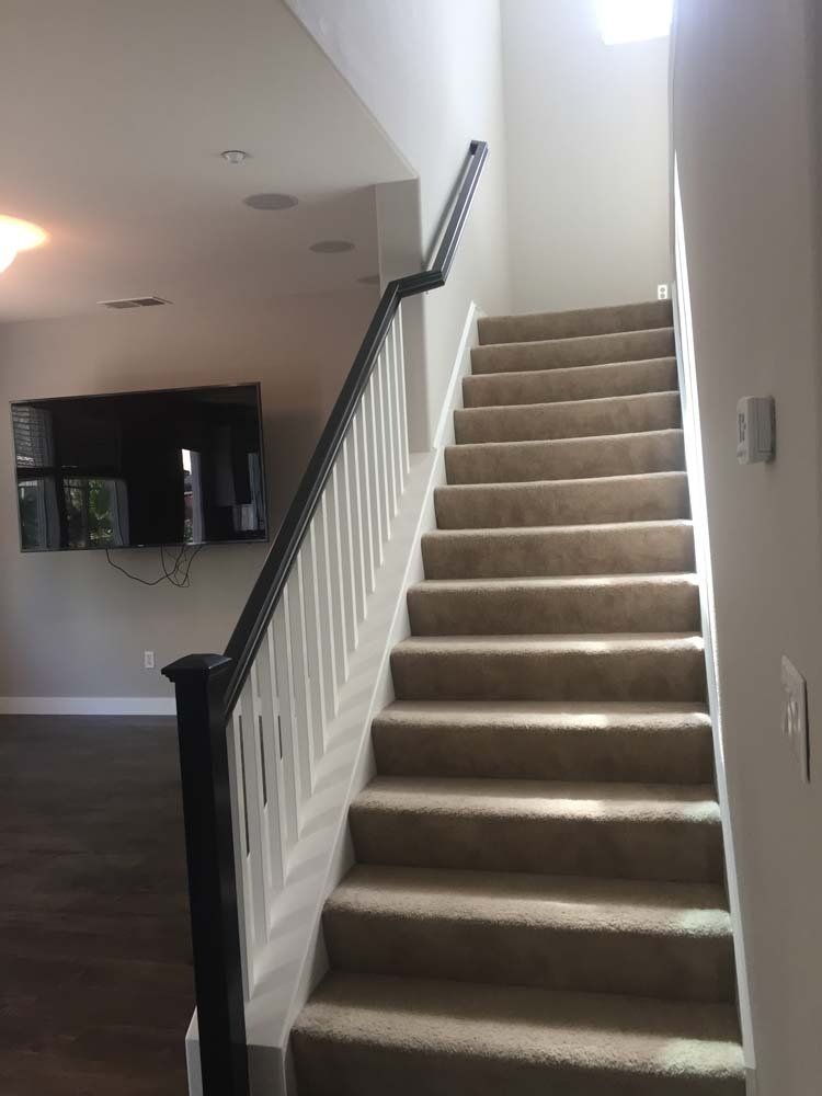 A set of stairs leading up to the second floor of a house.
