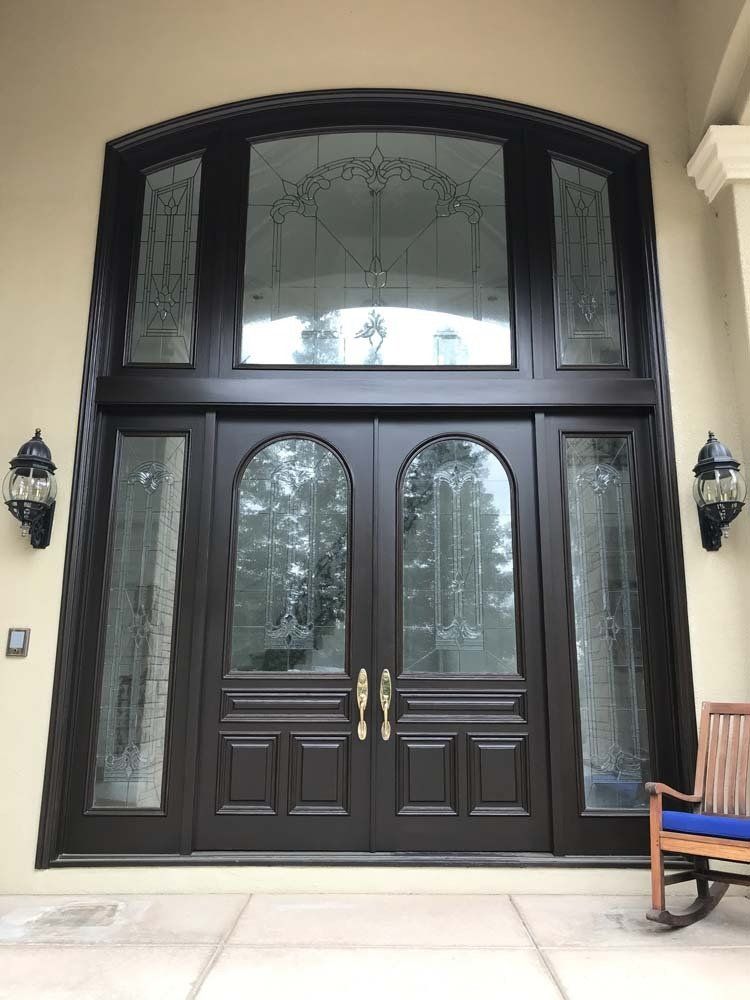 A large door with a bench in front of it