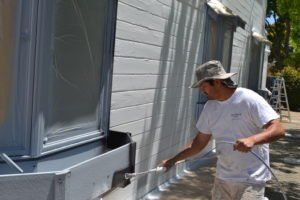 Man Painting House Siding in Napa, CA