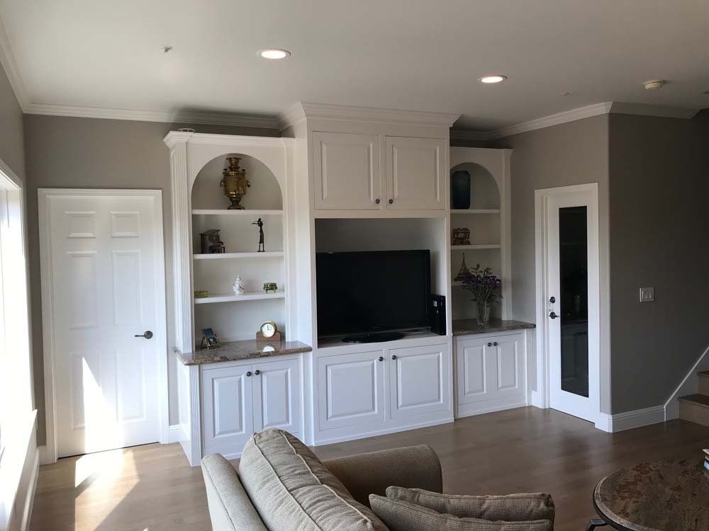 A living room with a couch and a flat screen tv