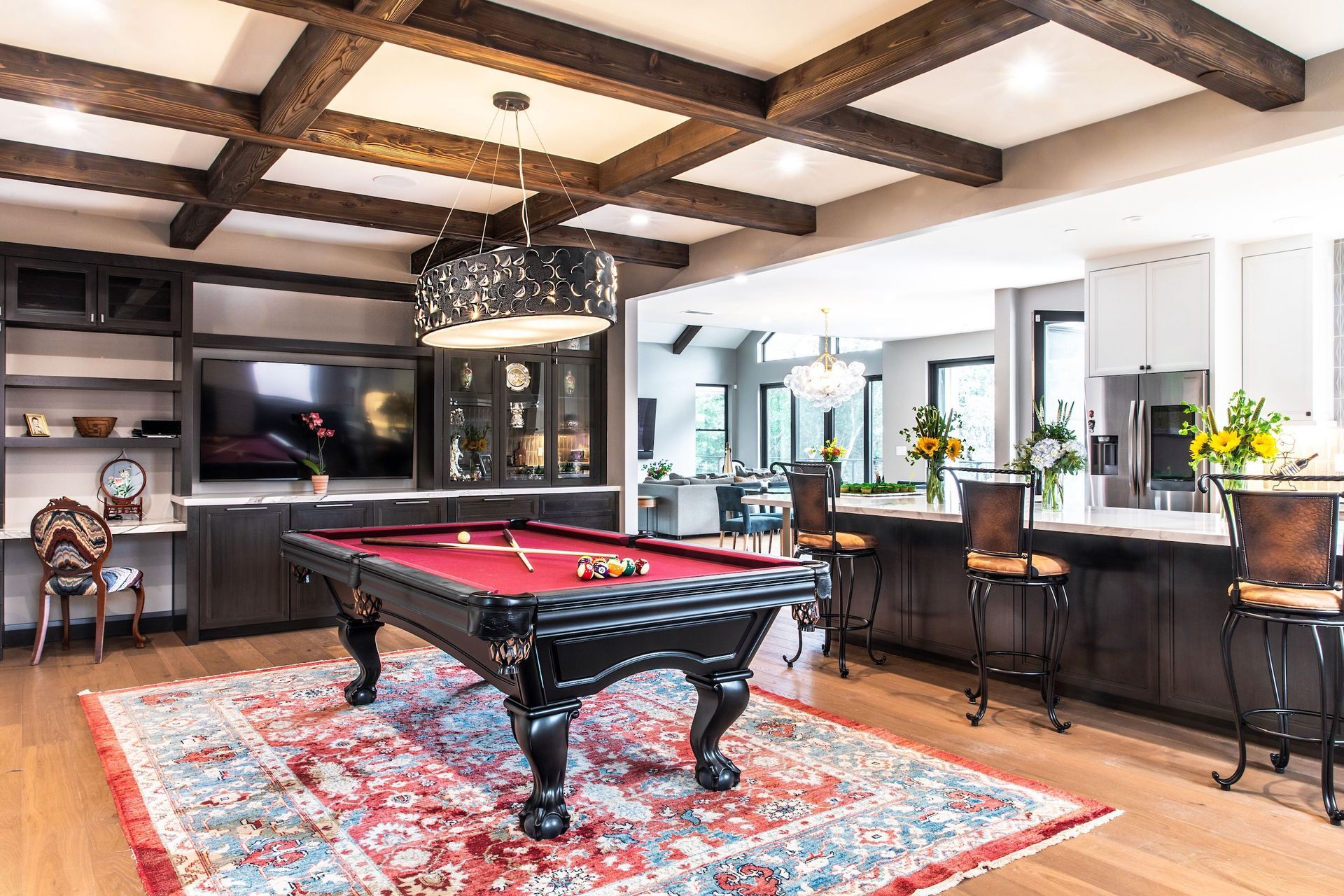 a pool table is in the middle of a living room