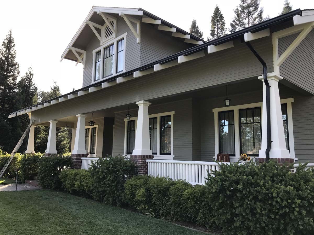 A house with a large porch and a lot of windows