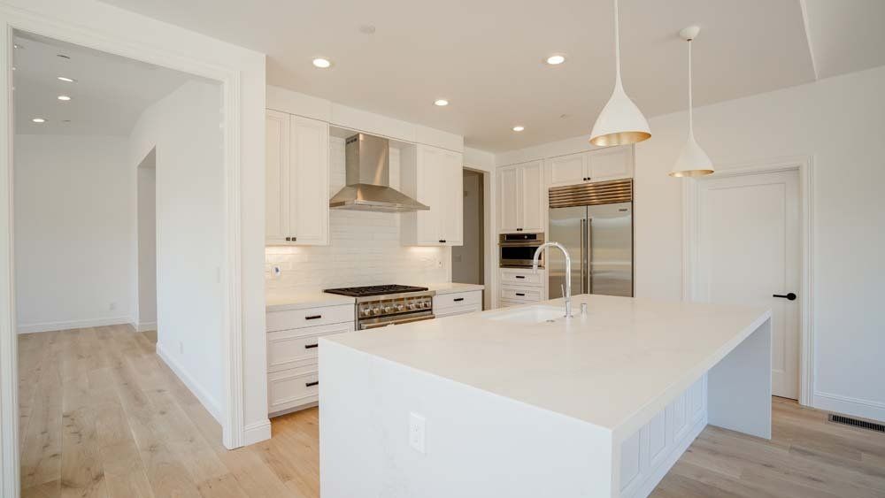 There is a large island in the middle of the kitchen.