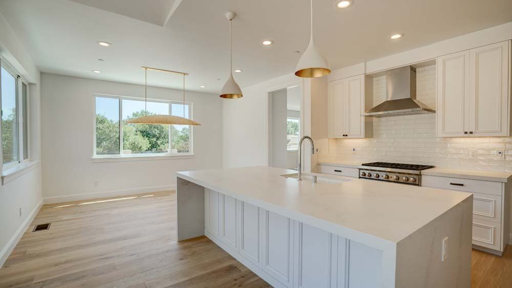 There is a large island in the middle of the kitchen.
