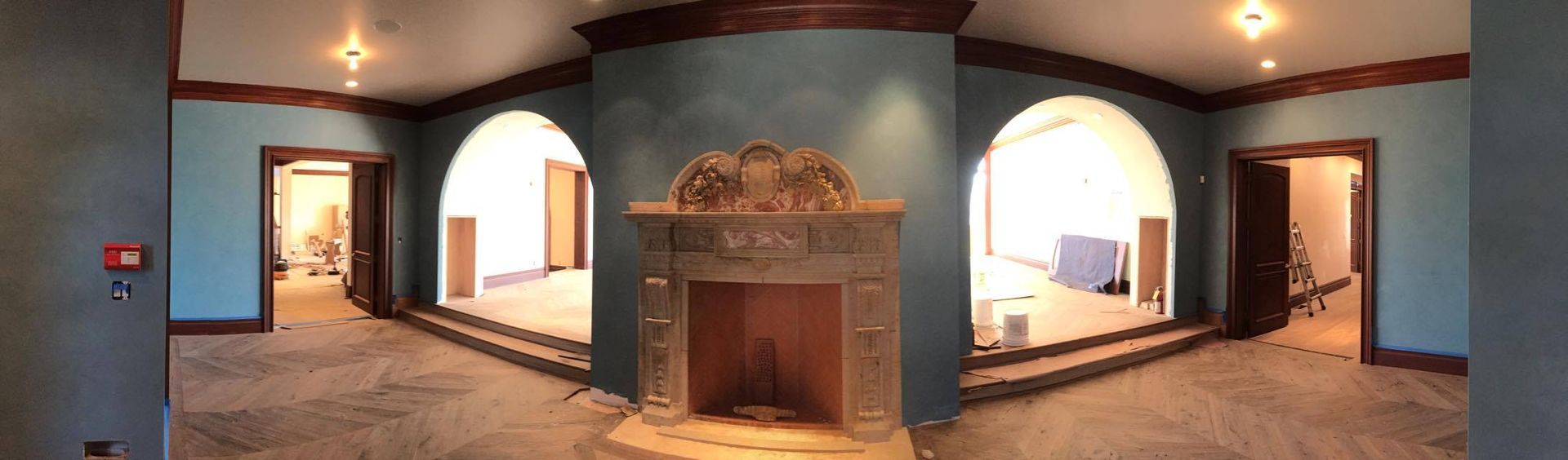 There is a fireplace in the middle of the room.