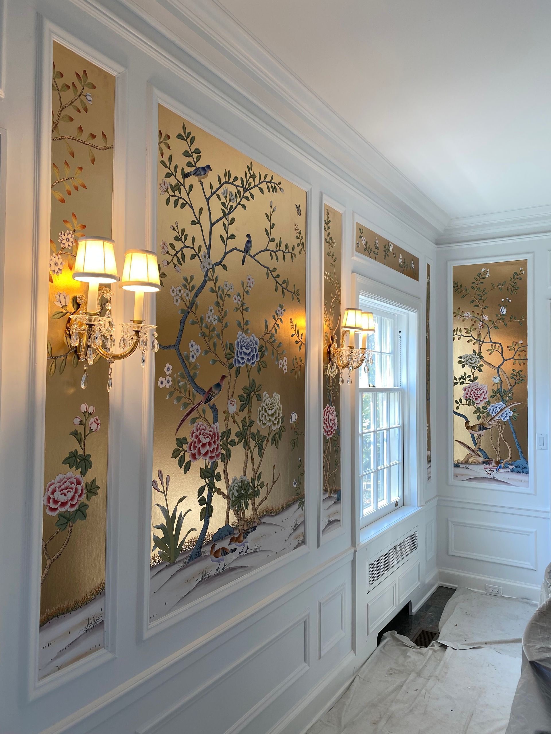 A wall with a picture of flowers on it