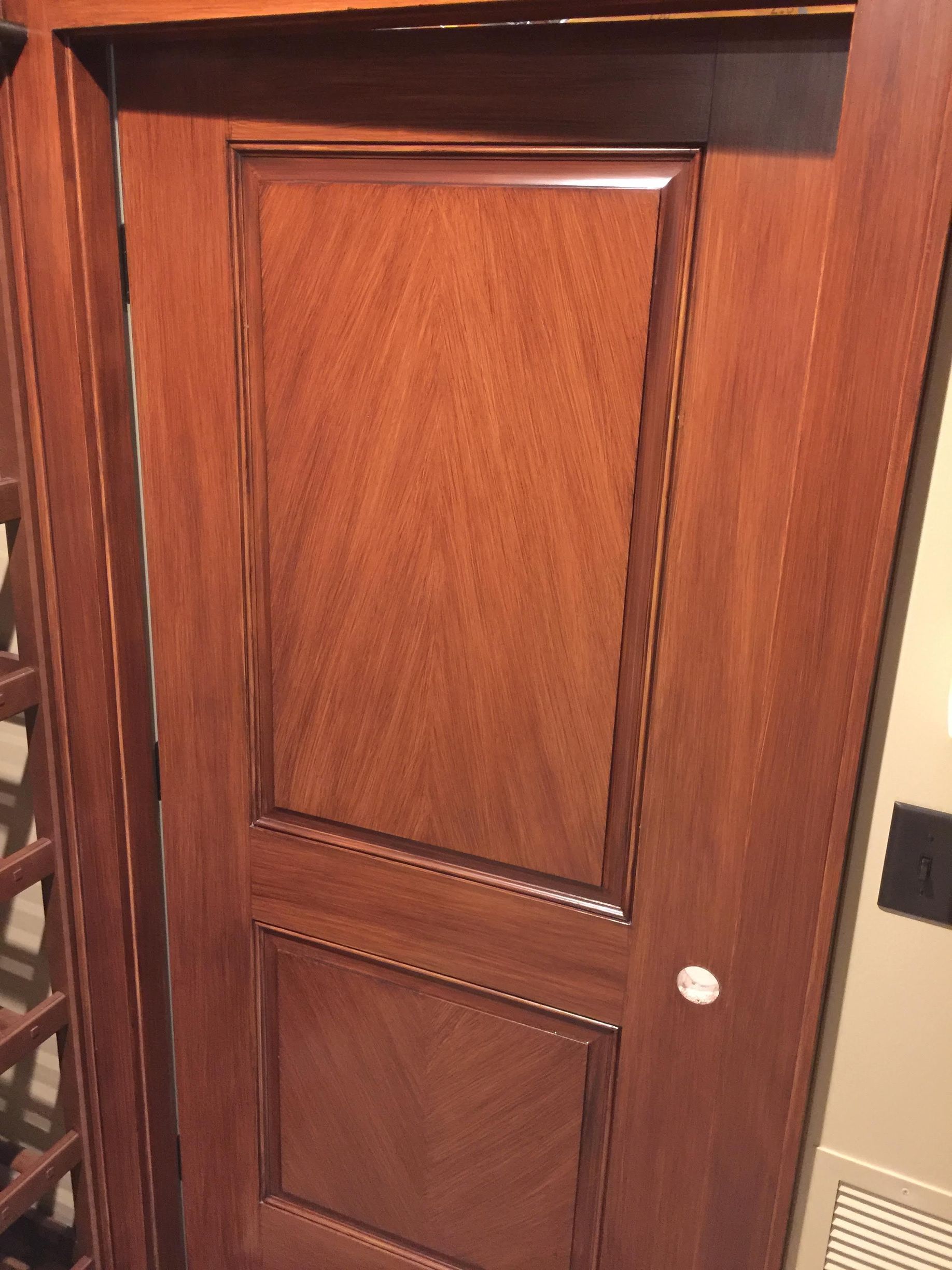 A close up of a wooden door in a room