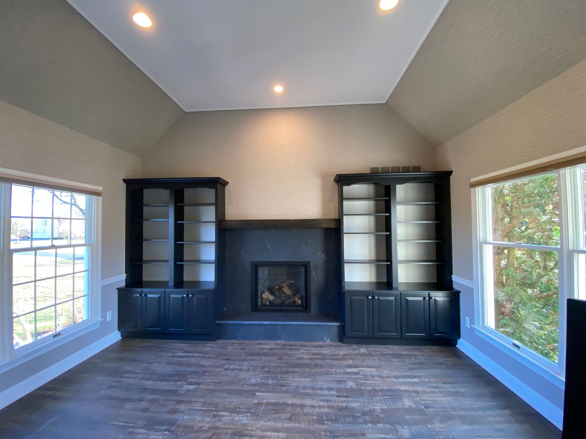 There is a fireplace in the middle of the room.