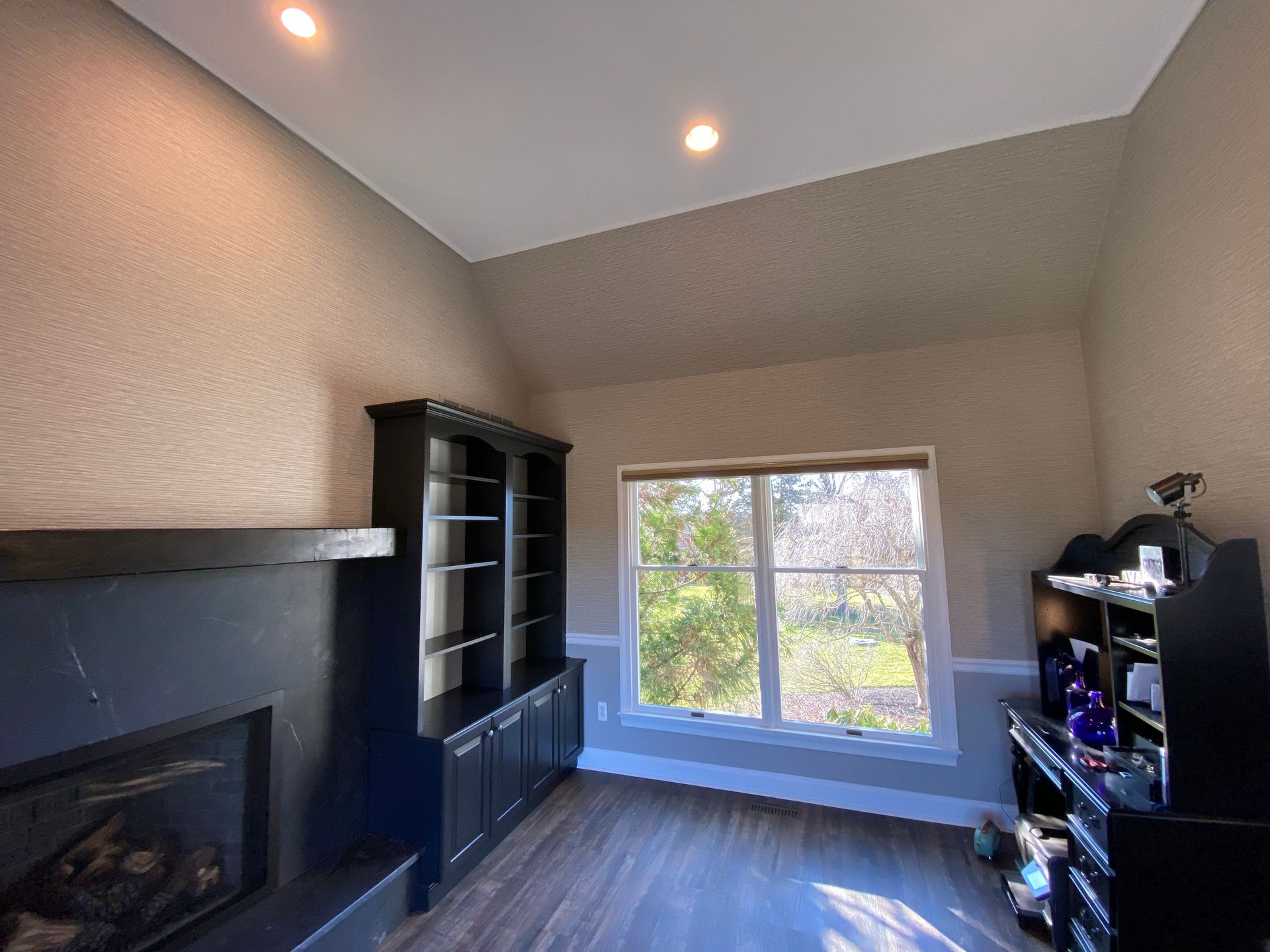 There is a fireplace in the middle of the room.