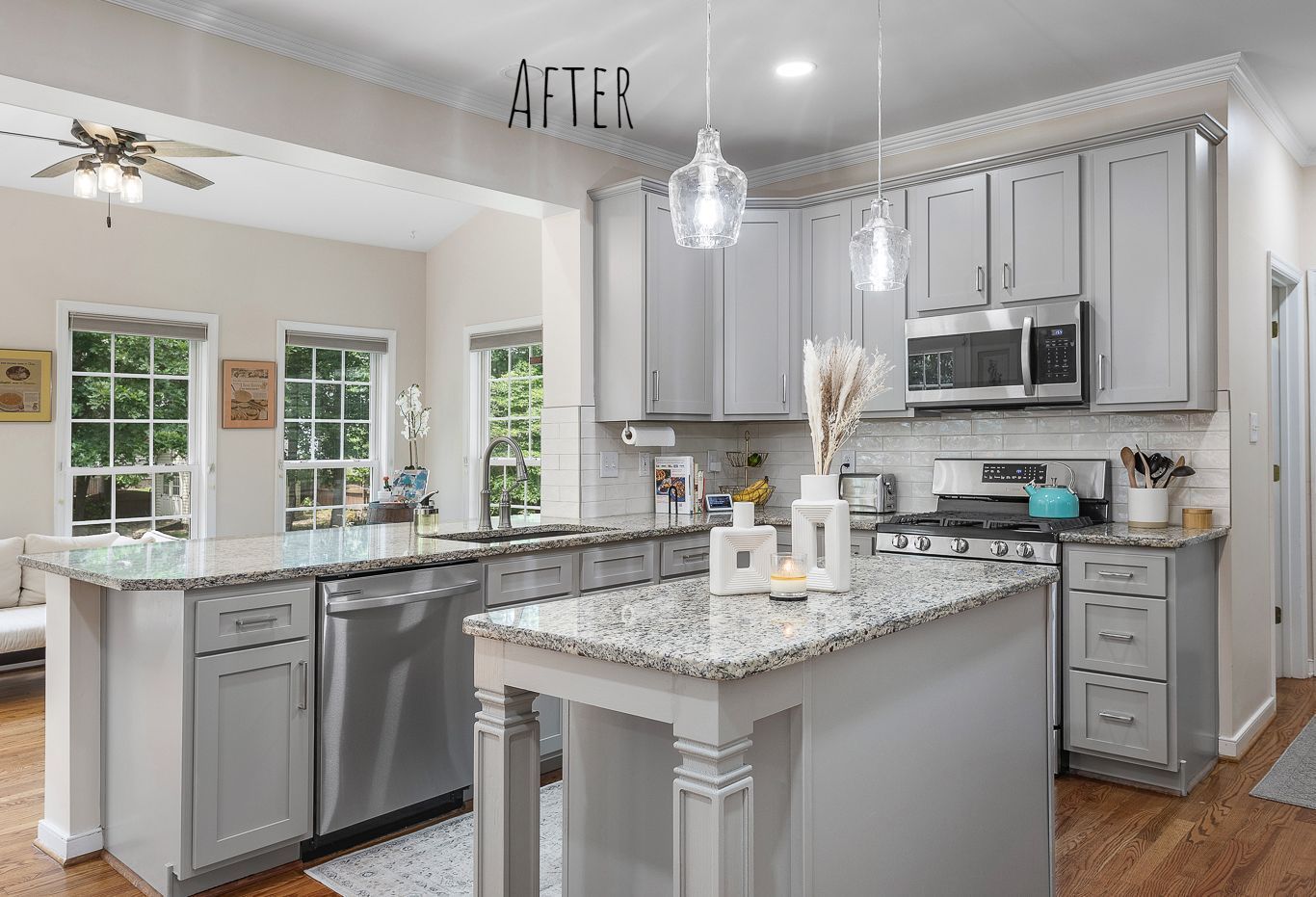 Cabinet Refacing: A kitchen with gray cabinets , granite counter tops , stainless steel appliances , and a large island.